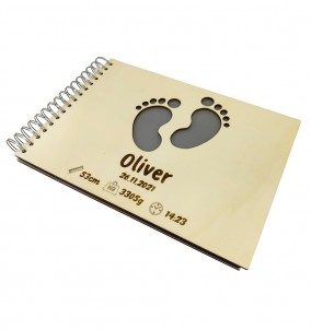 Personalized Baby Photo Album With Custom Wooden Cover. Baby's name and birthday are engraved on the cover.