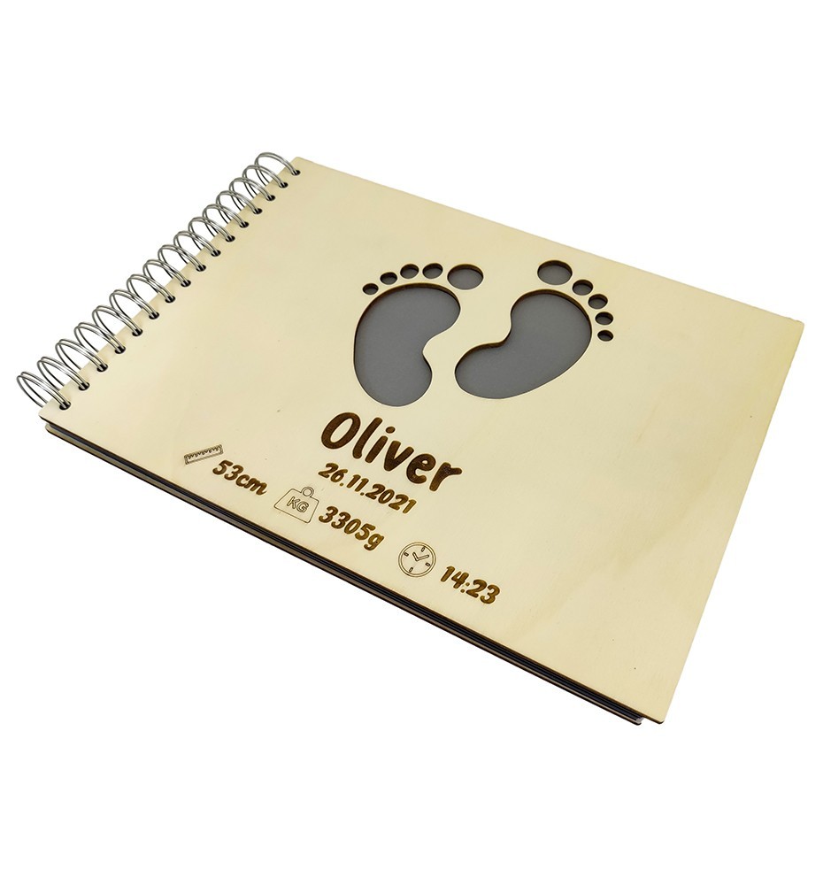 Personalized Baby Photo Album With Custom Wooden Cover. Baby's name and birthday are engraved on the cover.