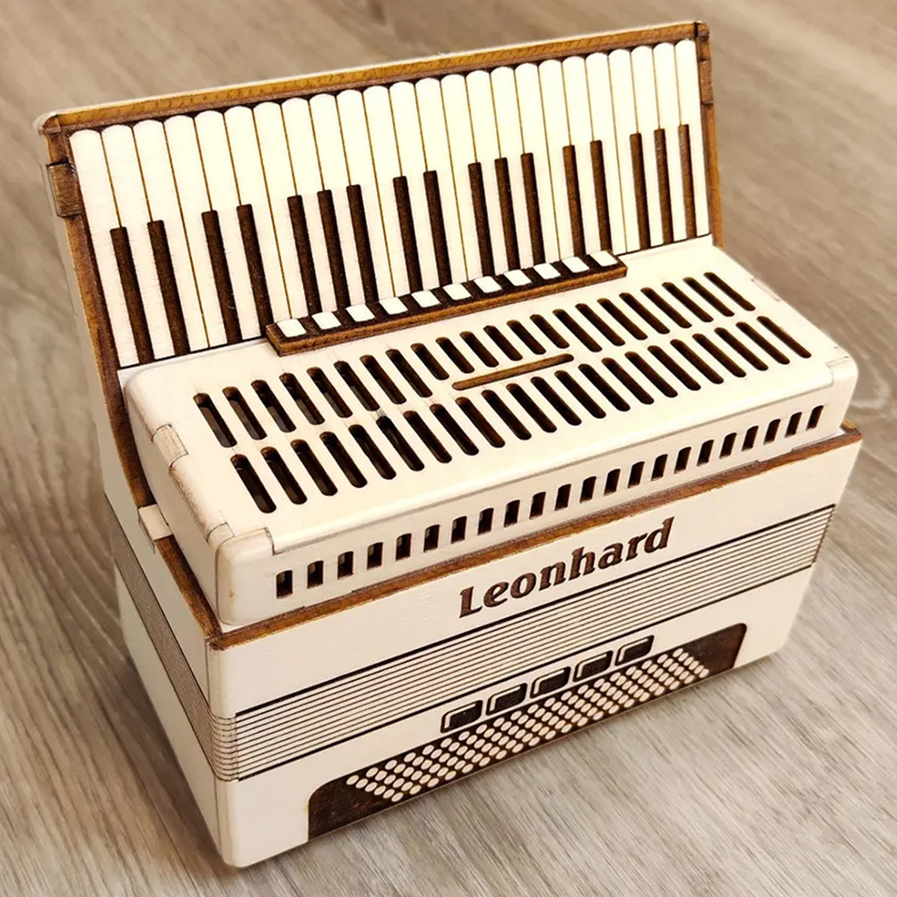 Accordion-shaped wooden money box with personalized name